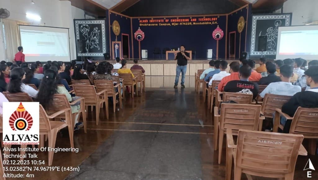 Speaker addressing students in the auditorium