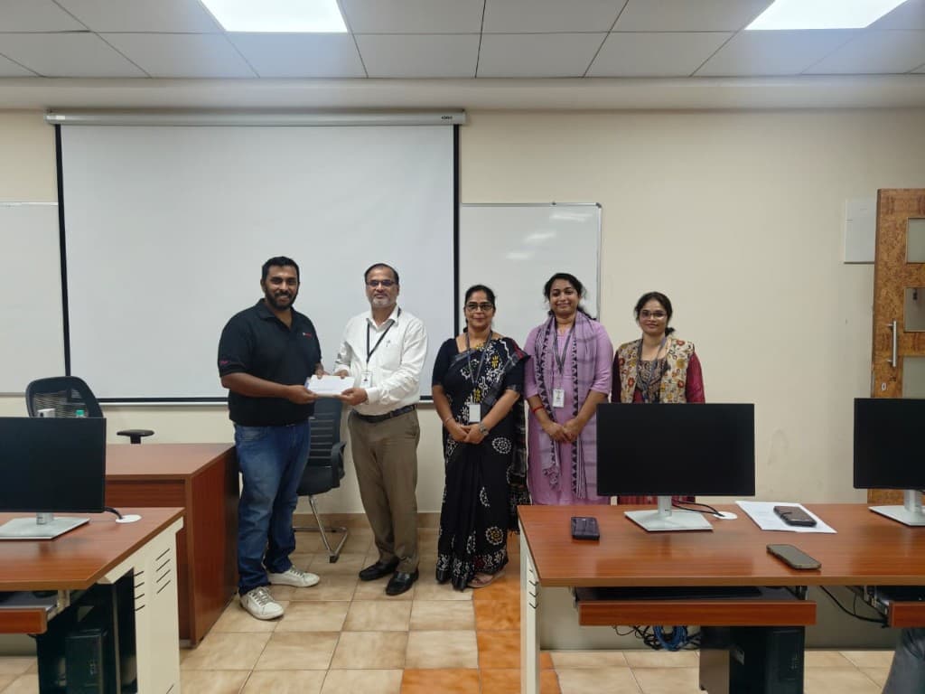 Recognition moment with colleagues in an office setting